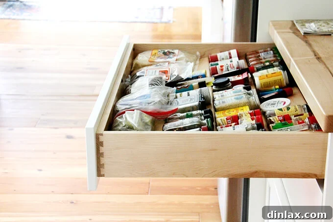 Close-up of the pristine butcher block countertop and shaker cabinets.