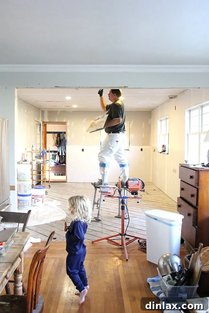 Drywall seams being taped and mudded in the kitchen, preparing walls for a smooth finish