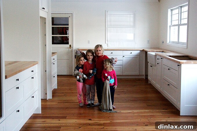 Children happily interacting in the newly renovated kitchen, symbolizing family life and comfort