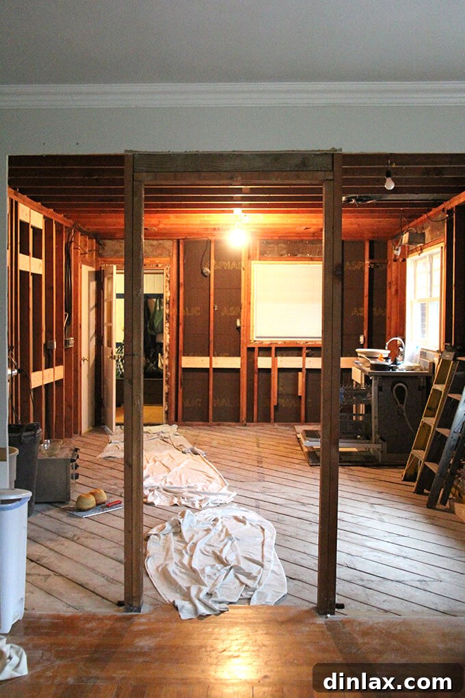 Expanded doorway between kitchen and dining/living room, creating an open concept space