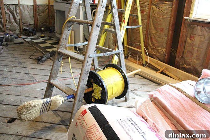 New electrical wiring being installed in the kitchen walls, showing updated infrastructure