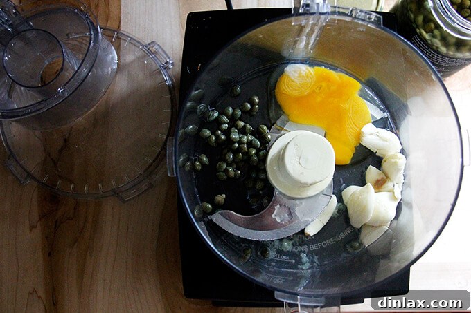 Whip Up Classic Garlic or Ramp Aioli 7 A food processor with ingredients to make classic aioli.