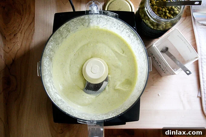 Whip Up Classic Garlic or Ramp Aioli 8 A food processor filled with homemade aioli.