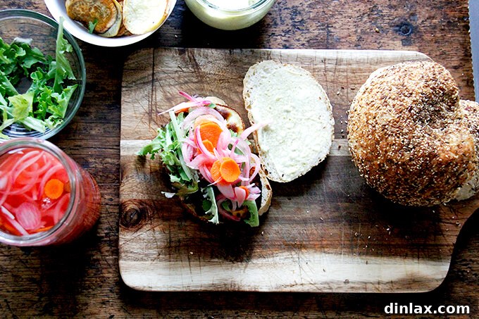 An overhead shot of two open-face sweet potato sandwiches, layered with all the ingredients, ready to be closed.