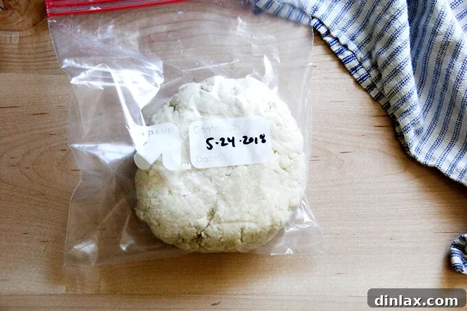 Rustic Rhubarb Frangipane Galette 13 A frozen round of pastry dough, clearly labeled with the date, resting in a Ziploc bag for convenient future use.