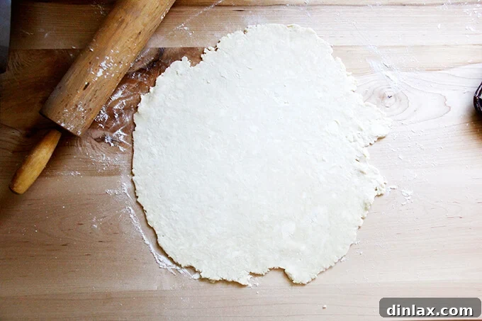 Rustic Rhubarb Frangipane Galette 15 A beautifully rolled-out pastry dough on a floured surface, achieving an impressive 11-inch diameter.