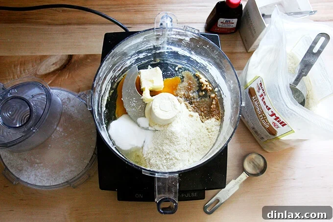 Rustic Rhubarb Frangipane Galette 20 All the components for the frangipane – almond flour, sugar, salt, butter, egg, and vanilla – carefully placed into the food processor bowl.