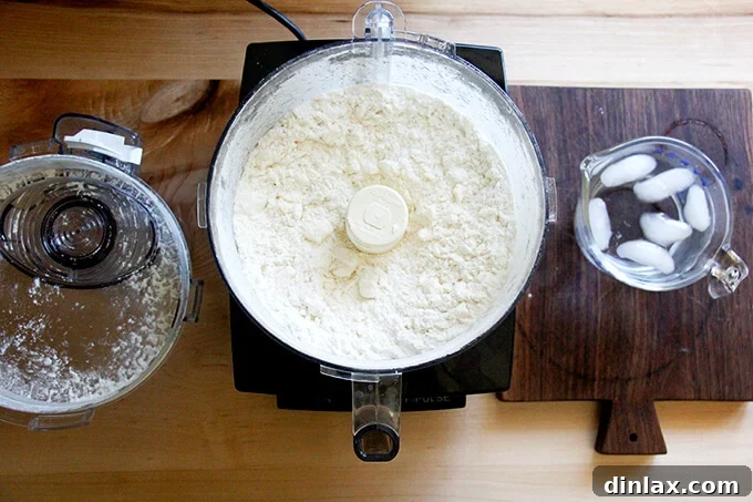 Rustic Rhubarb Frangipane Galette 8 A close-up shot of the mixture within the food processor, clearly showing butter pieces the size of peas mingled with the dry ingredients.