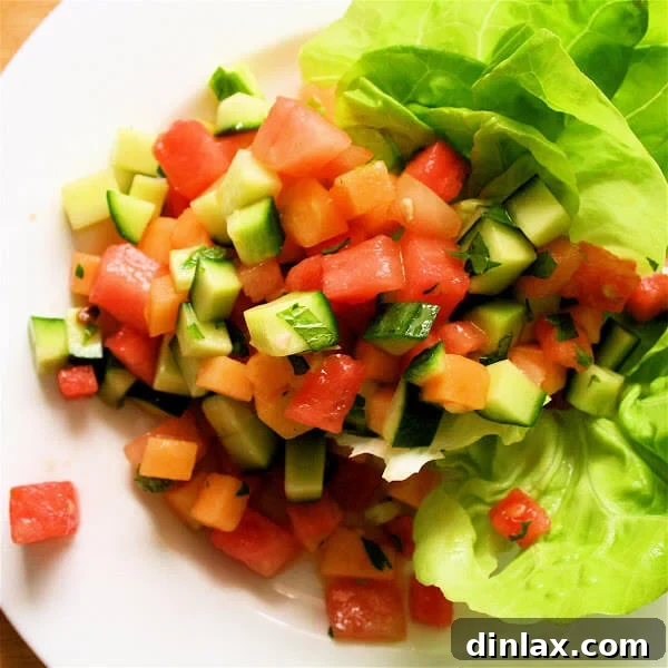 Refreshing melon and cucumber salad with a vibrant mint vinaigrette.