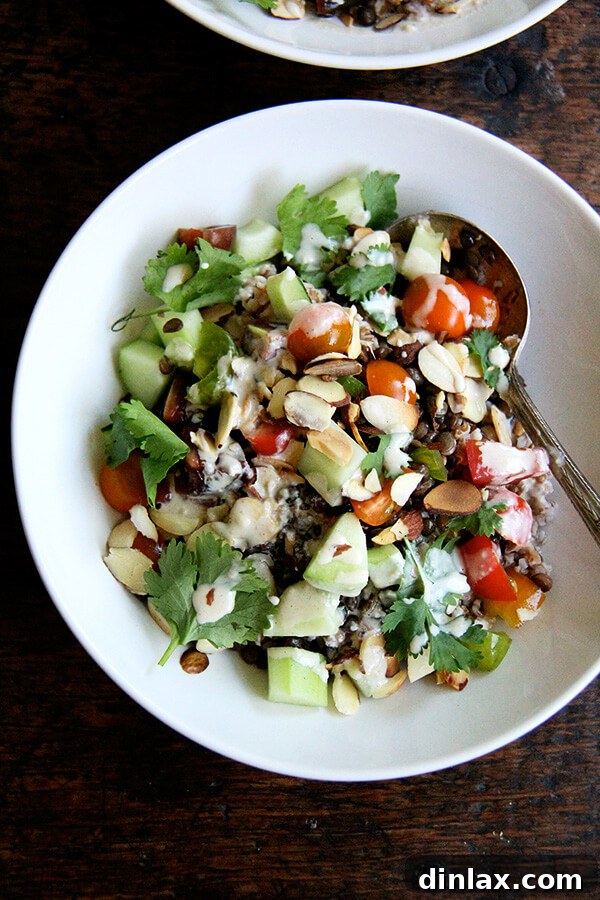 Hearty bulgur and lentil bowl, topped with a creamy lemon-tahini drizzle.