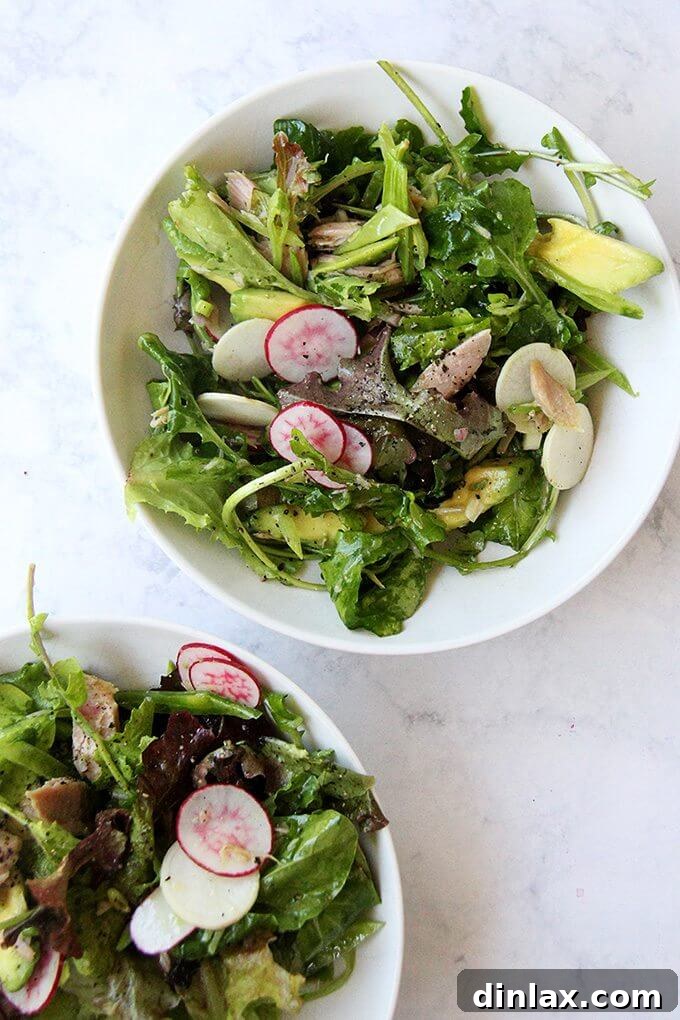 Quick 10-minute summer meal featuring fresh greens, tuna, and a light shallot vinaigrette.