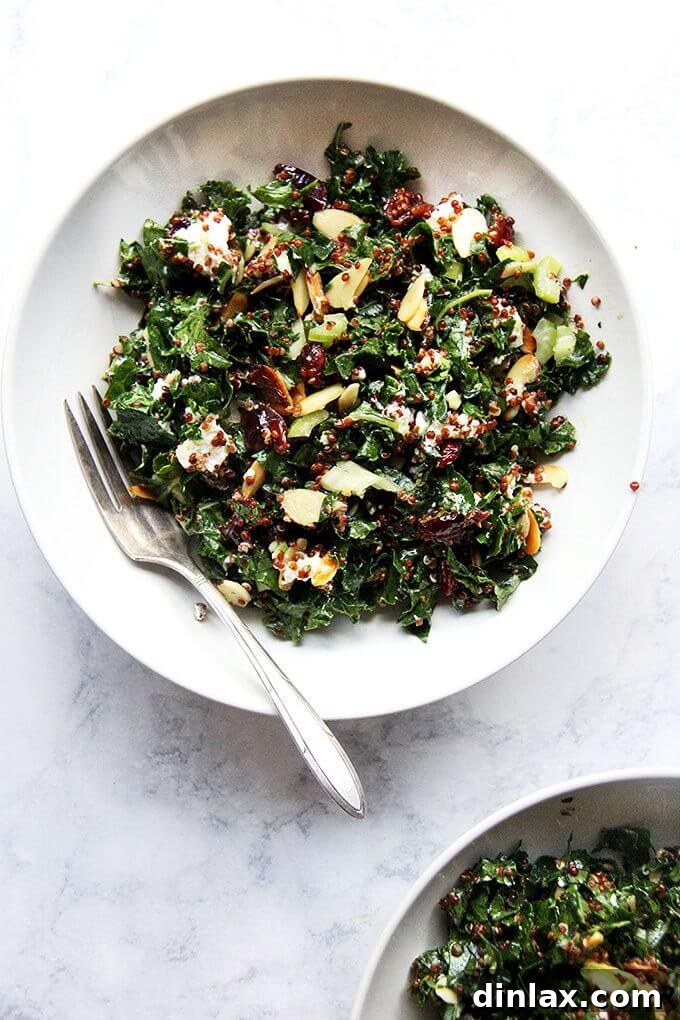 Wholesome kale and quinoa salad with cranberries, goat cheese, and crunchy almonds.