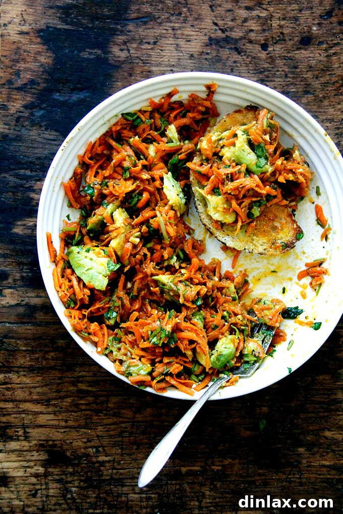 Vibrant Moroccan carrot salad featuring spicy harissa and creamy avocado.