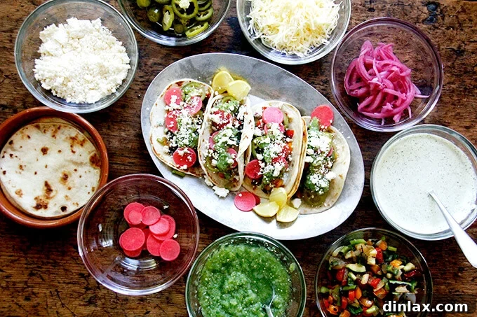 Finished grilled vegetable tacos with various toppings