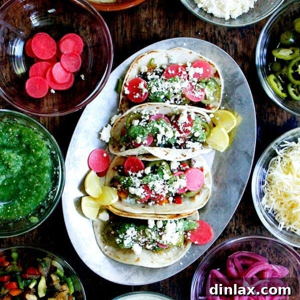Grilled vegetable tacos with vibrant tomatillo salsa and creamy cilantro-lime crema