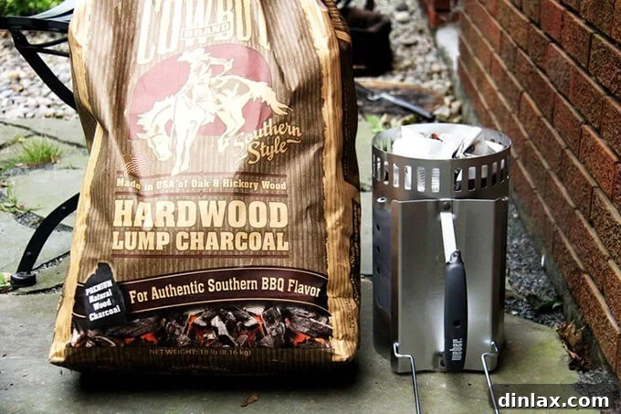 Charcoal briquettes heating in a chimney starter