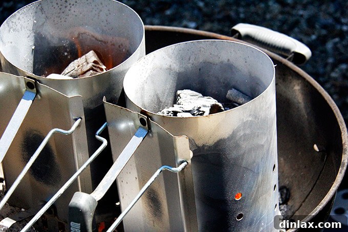 Hot charcoal being transferred to the grill