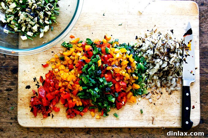 Chopped grilled vegetables on a cutting board