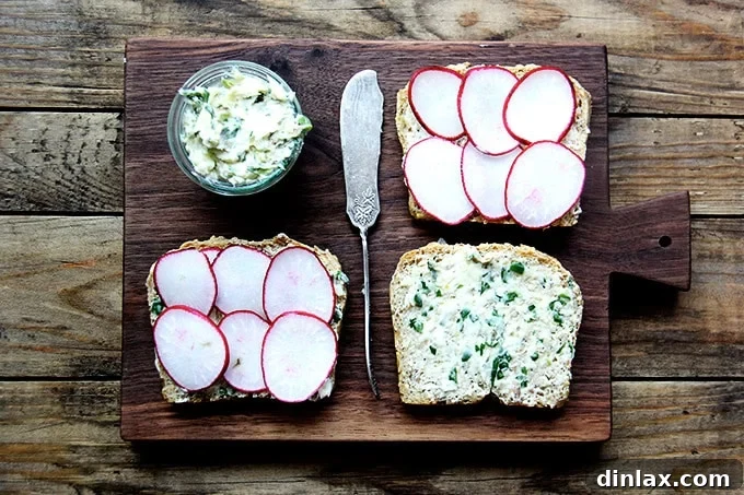 Several elegant radish and turnip tartines displayed on a rustic wooden board, showcasing their vibrant colors
