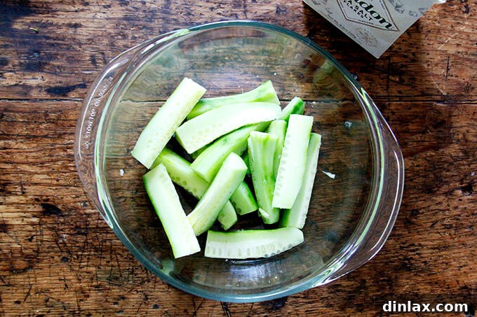 Close-up of salted cucumber slices, highlighting their crisp texture and simple preparation