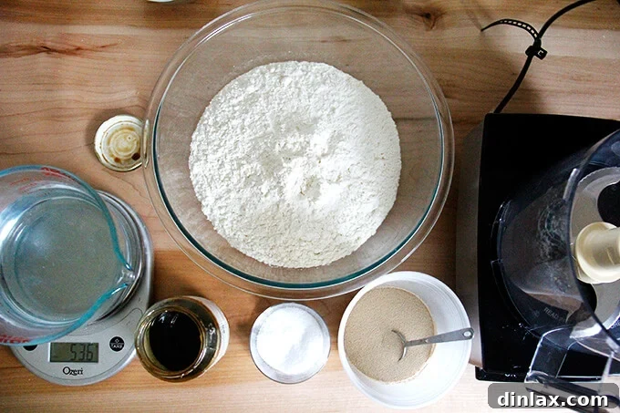 A kitchen counter showcasing essential bagel-making ingredients including flour, salt, and yeast, ready for preparation.