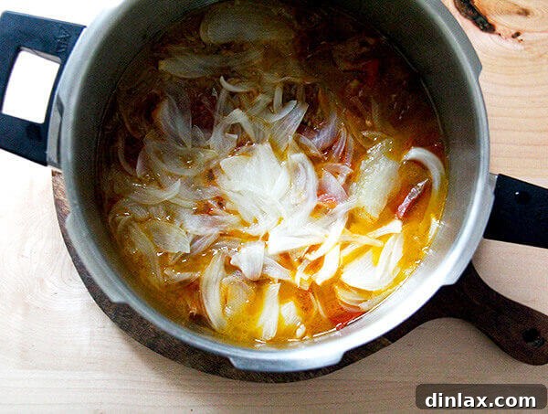 A vibrant bowl of homemade pressure cooker tomato-basil sauce.