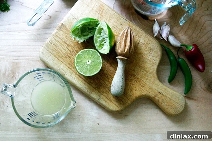 A liquid measure filled with fresh lime juice.