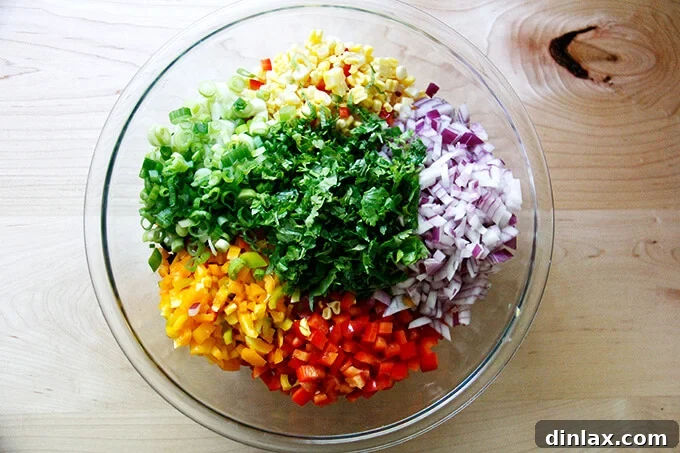 A large bowl showcasing all the colorful ingredients for Texas Caviar, mixed together and ready for the final dressing touches.