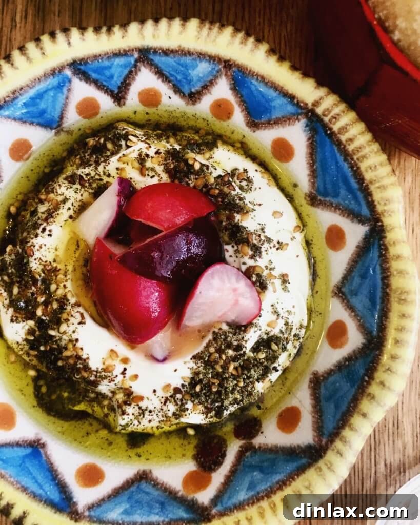Parisian Gems 11 A delicious mezze plate at Mokonuts featuring labneh, olive oil, za'atar, radishes, and pita bread.