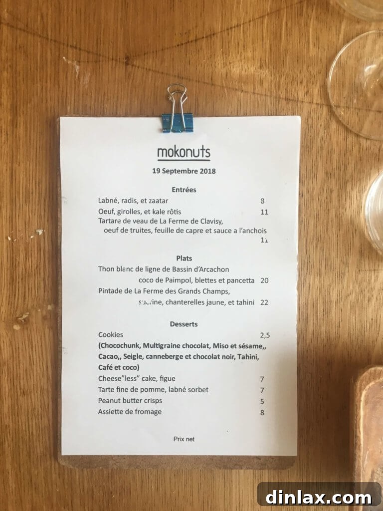 Parisian Gems 16 Omar Koreitem, the chef and co-owner of Mokonuts, preparing dishes in the kitchen.