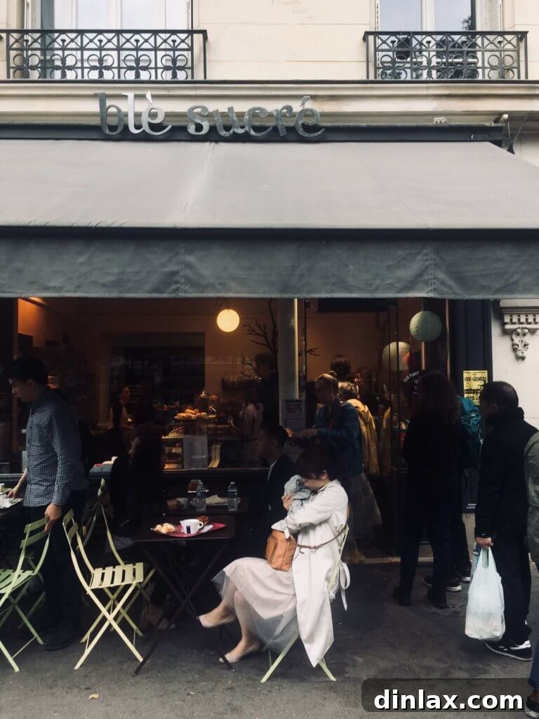 Parisian Gems 22 An irresistible pain au chocolat from Blé Sucré, showcasing its golden crust and chocolate filling.