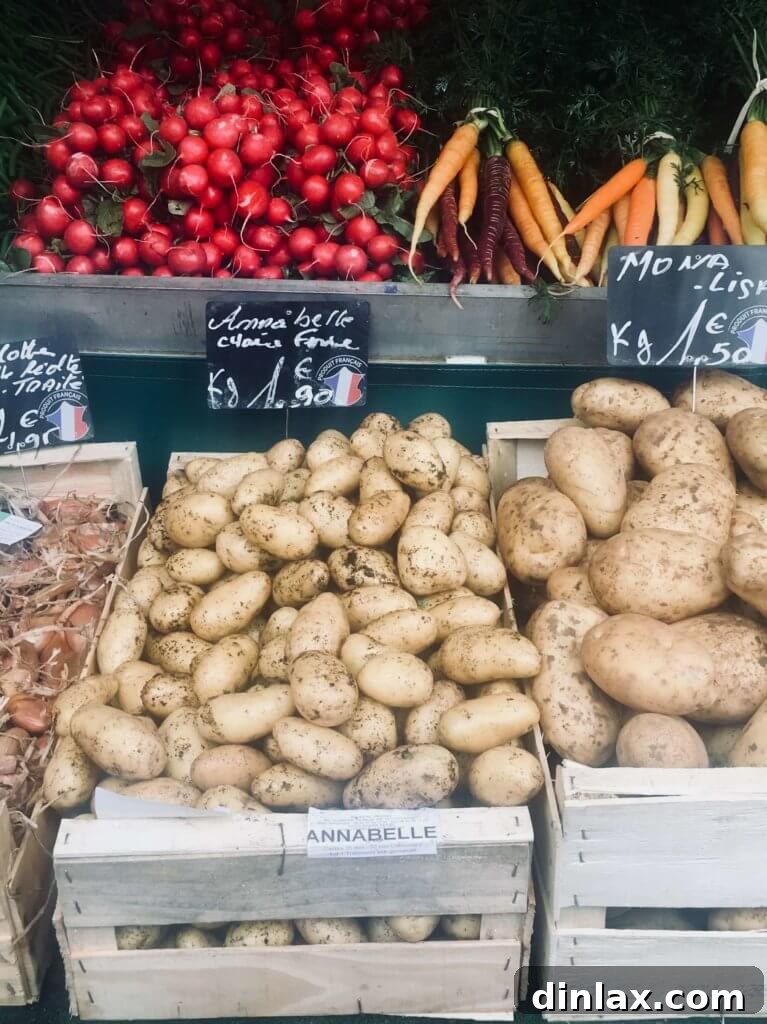 Parisian Gems 25 The bustling stalls of Marché d'Aligre, showcasing fresh produce and local vendors.