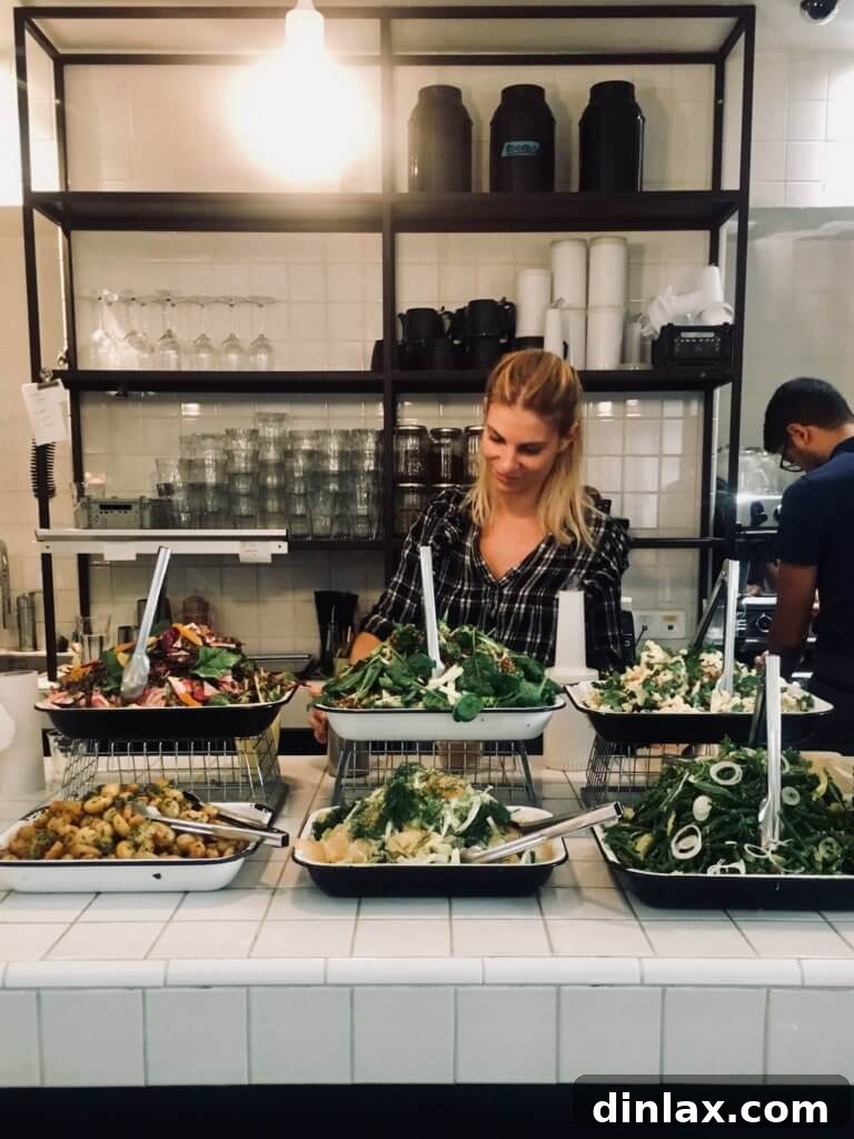 Parisian Gems 27 A fresh and vibrant salad served at Merci, with various greens and toppings.