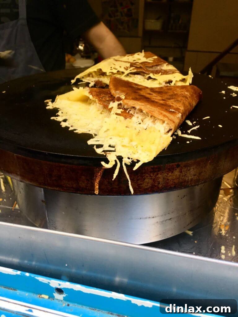 Parisian Gems 36 The griddle at La Droguerie, with a crêpe being expertly prepared.