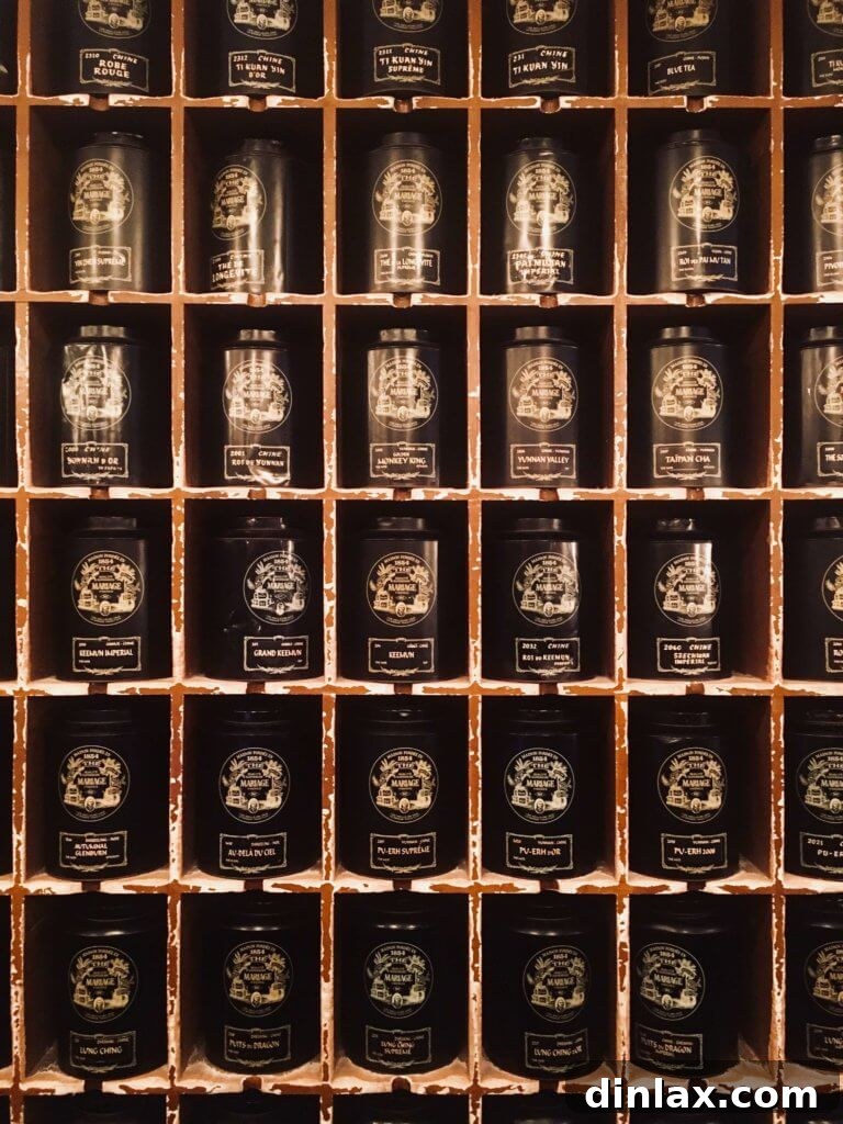 Parisian Gems 39 A delicate teacup and saucer with a pot of tea, presented elegantly at Mariage Frères.