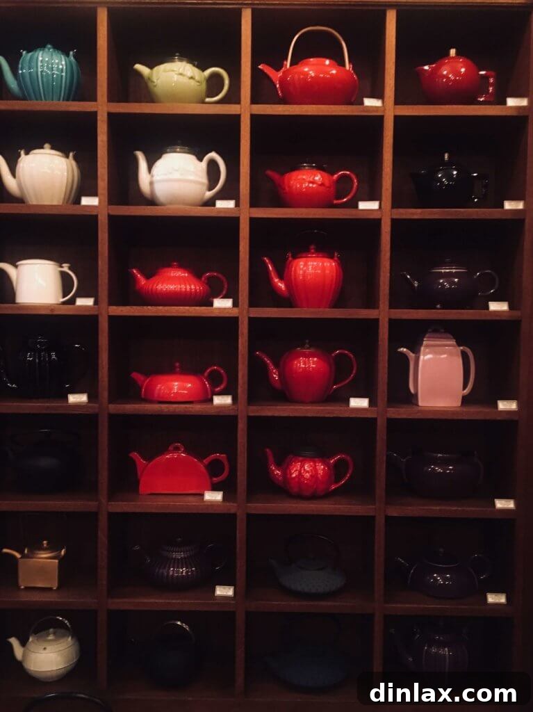 Parisian Gems 40 A display of Mariage Frères' signature black tea packaging and accessories.