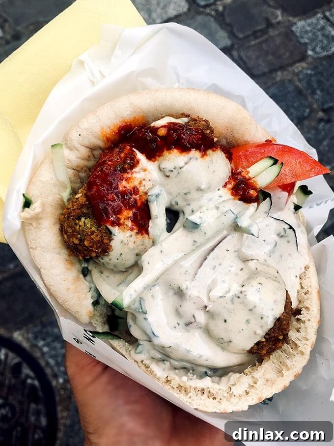 Parisian Gems 43 A close-up shot of the mouth-watering falafel ingredients and sauces.