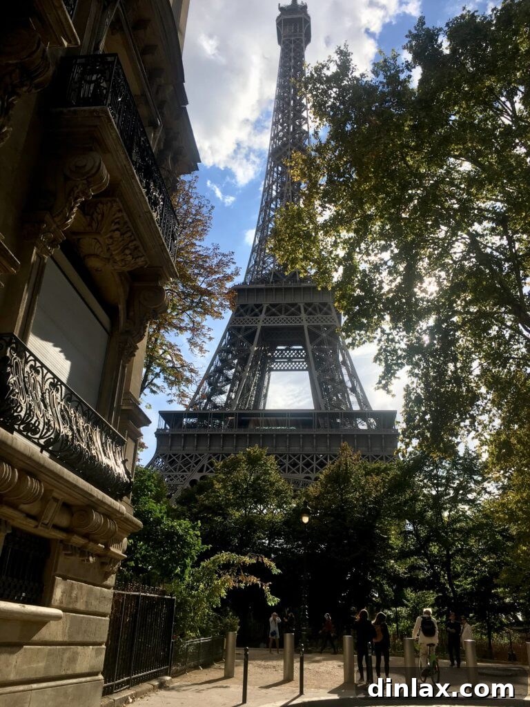 Parisian Gems 6 A Parisian street scene with classic architecture and a glimpse of daily life.