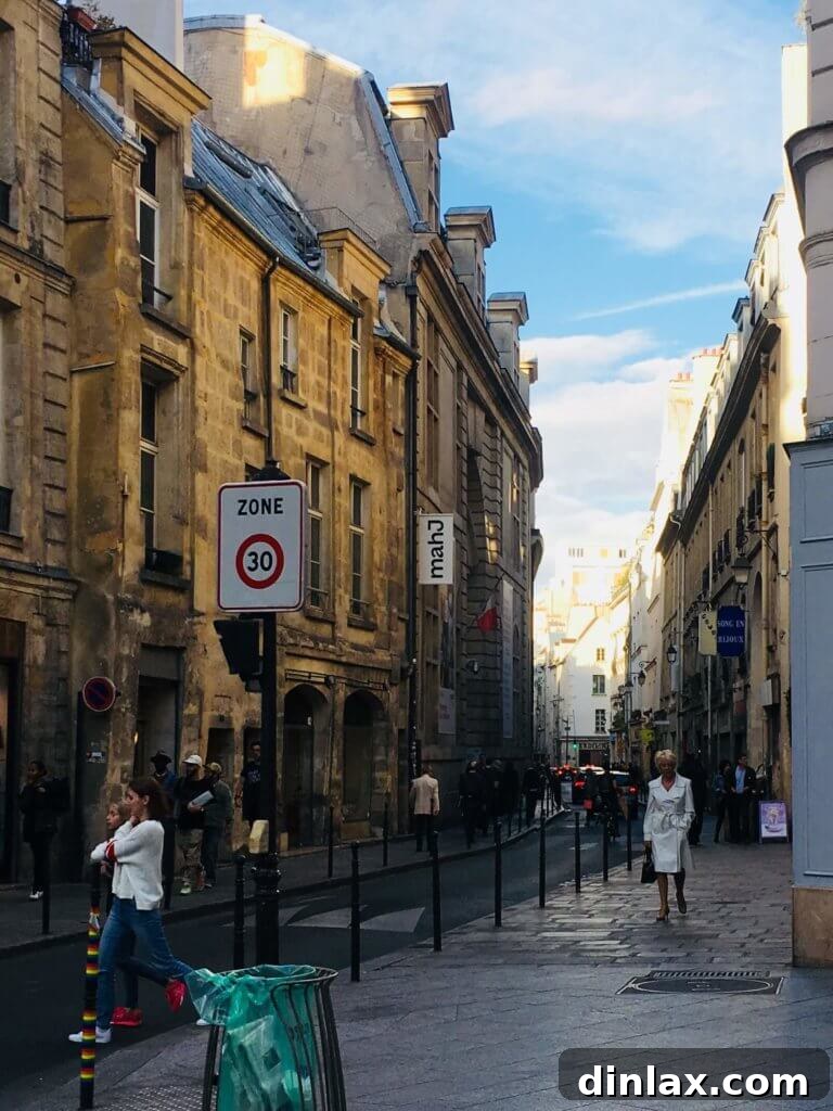 Parisian Gems 59 A street scene in Paris, capturing the elegant architecture and daily life.