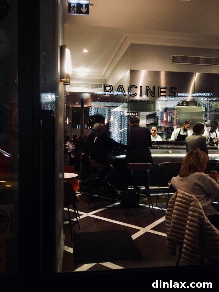 Parisian Gems 65 The inviting interior of Racines des Prés, a sophisticated Parisian restaurant.
