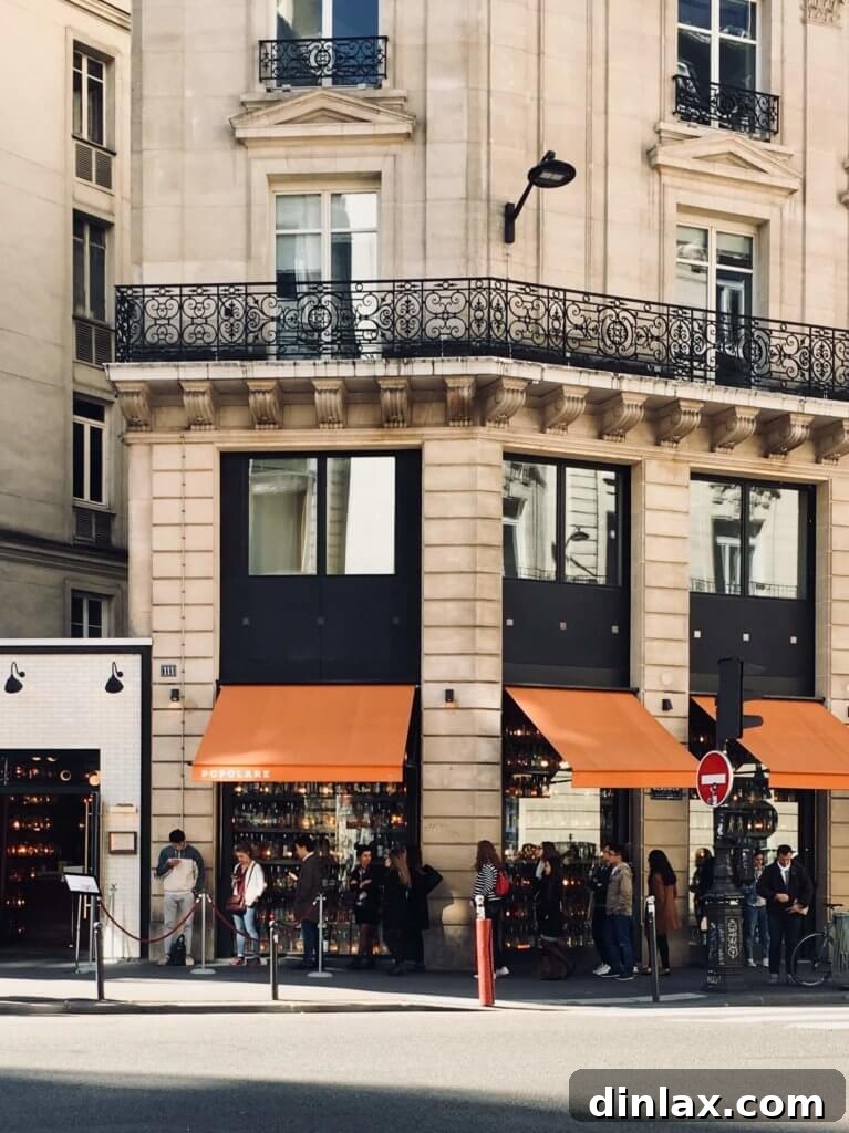 Parisian Gems 73 A cozy and inviting bedroom within the Airbnb apartment.