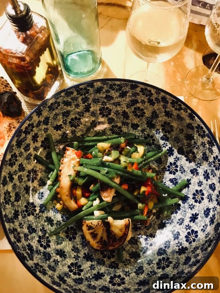 Parisian Gems 78 A delectable octopus salad served at Pink Mamma, colorful and appetizing.