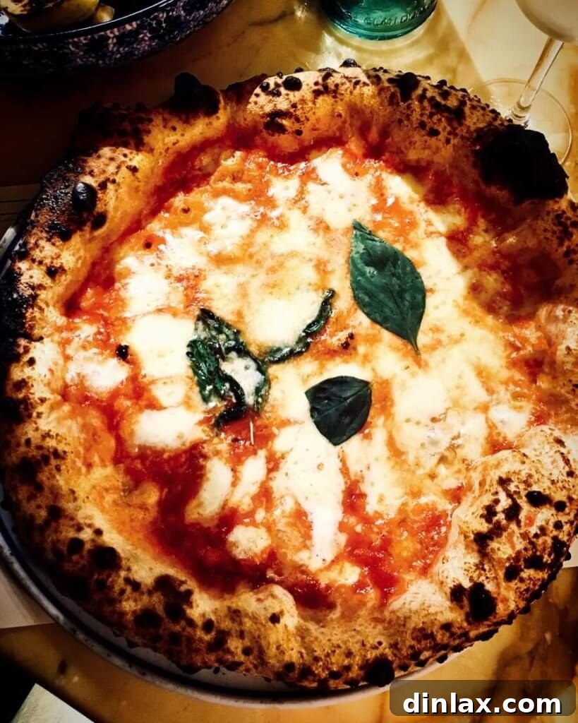 Parisian Gems 79 A perfectly baked Mammargherita pizza from Pink Mamma, with bubbly cheese and fresh basil.