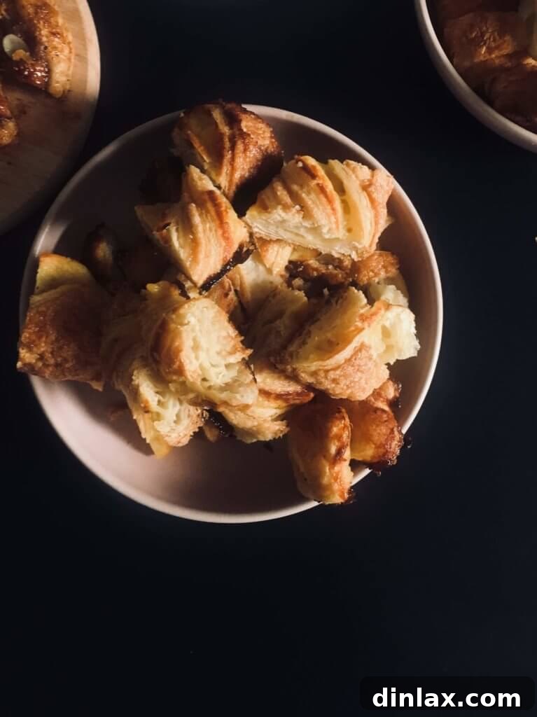 Parisian Gems 10 Close-up of a golden, twisted sacristan pastry, a specialty of Du Pain et des Idées.