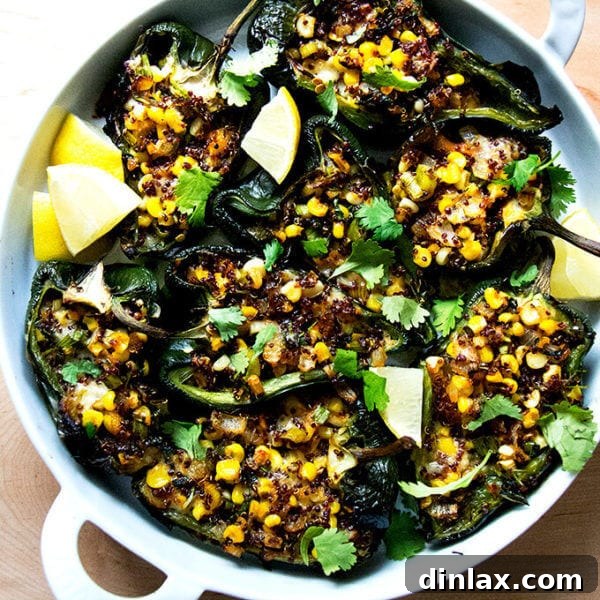 A pan of blistered poblano peppers stuffed with quinoa, corn, and Monterey Jack, ready to be served.