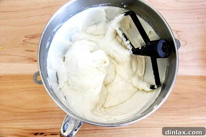 Golden Sugar-Crusted Apple Cobbler 5 An overhead shot of a stand mixer with the smooth, fluffy batter for the apple cobbler after being fully beaten.