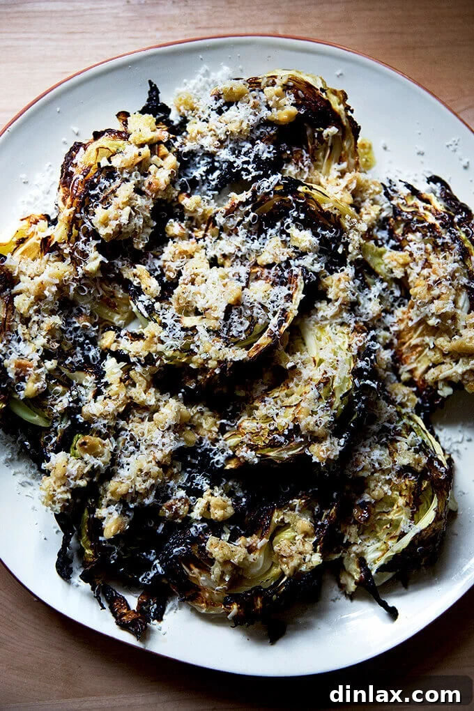 Perfectly roasted cabbage wedges, golden-brown and ready to be drizzled with a savory sauce.