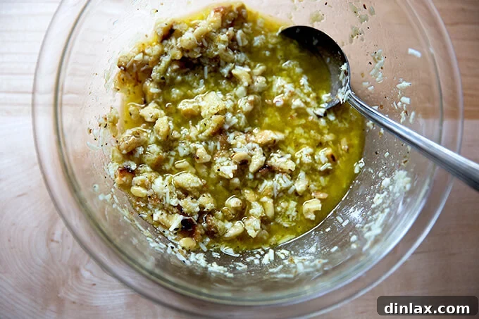 A bowl containing the freshly prepared walnut salsa, perfectly stirred and ready to be served over the roasted cabbage.