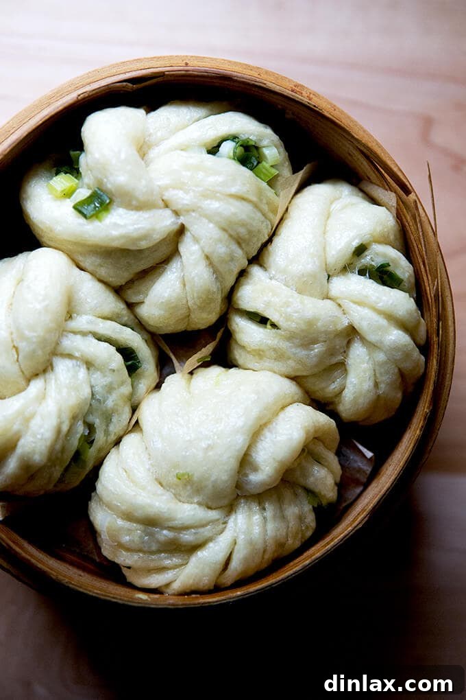 Chinese Steamed Scallion Twists 2 A steamer filled with freshly made, fluffy Chinese steamed scallion buns, ready to be enjoyed.