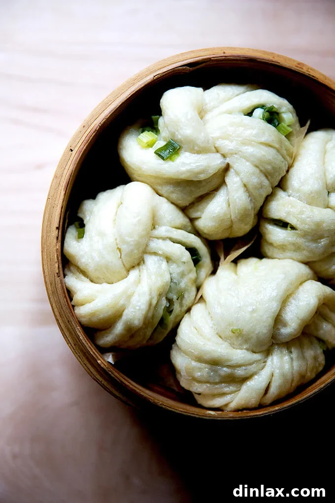 Chinese Steamed Scallion Twists 16 Overhead shot of a steamer basket open to reveal 4 perfectly steamed scallion buns, fluffy and ready.